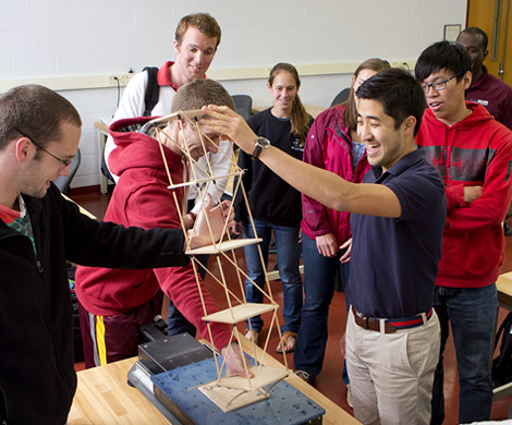 Students work on building a model design of a multi-storied structure.